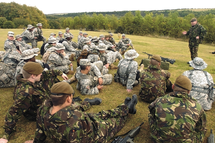 T-Patcher infantrymen from the 36th Infantry Division, Texas Army National Guard, join their British Army counterparts for weapons classes during the second phase of Operation Glow Worm in Southern England.  — Photo by Master Sgt. Brenda Benner, Texas Military Forces Public Affairs